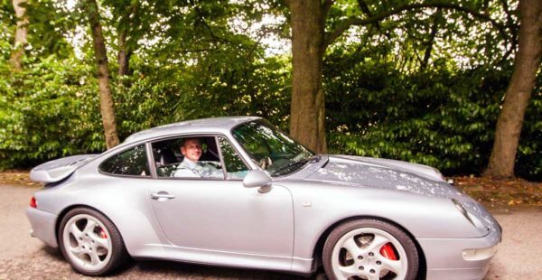 Polar Silver Porsche 911 (993) Turbo supercar with the Wedding Groom at the wheel